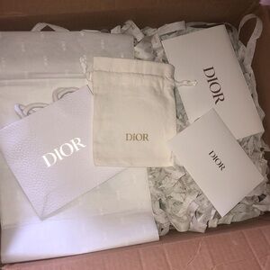 Dior Beauty Packaging: envelope, drawstring bag, filler streamers, tissue paper